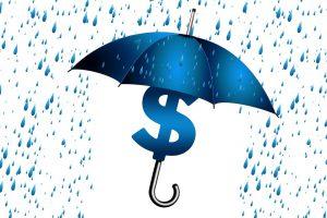 Parasol chroniący symbol dolara przed deszczem
